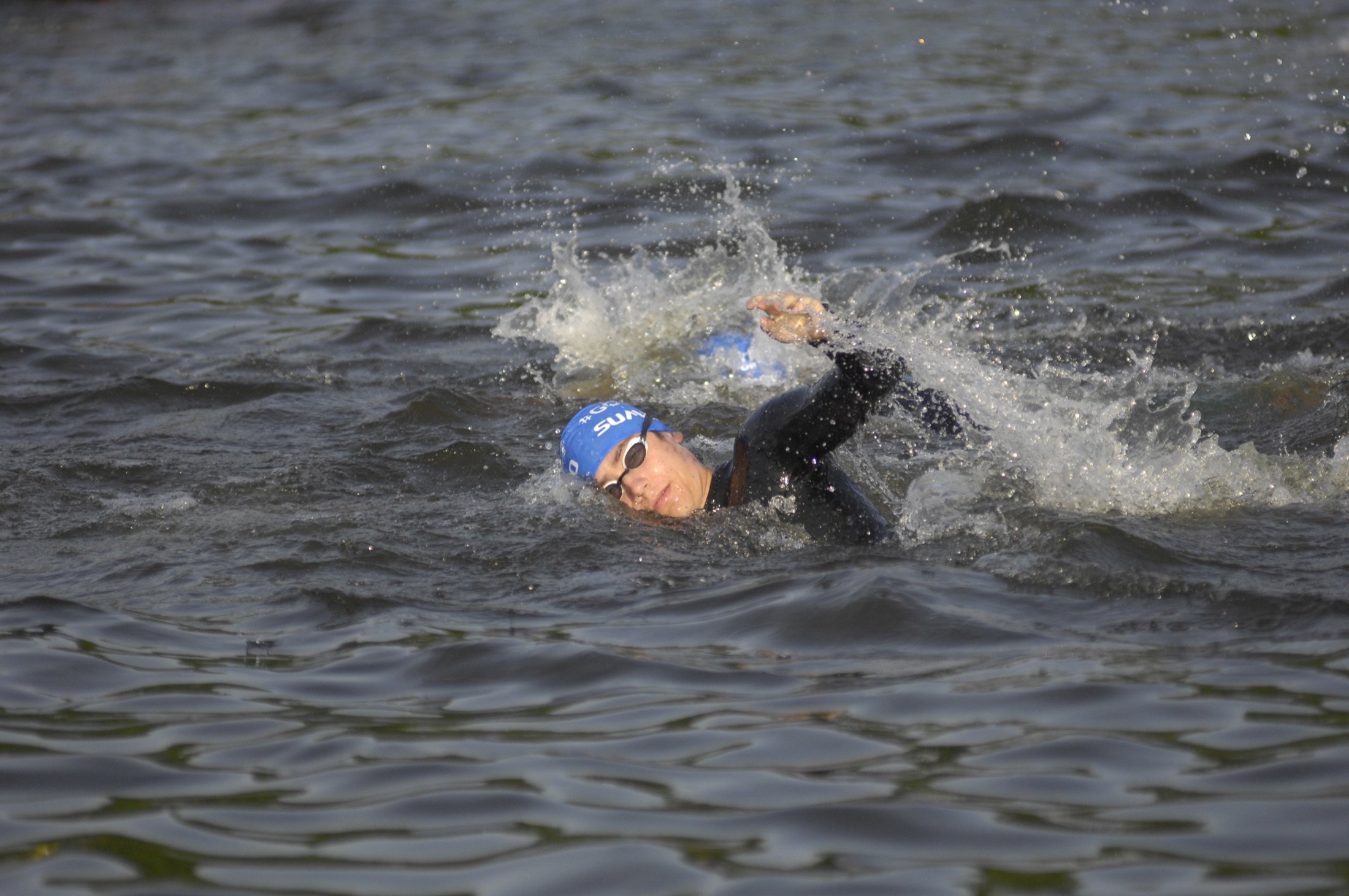 Triathlete swimming in open water
